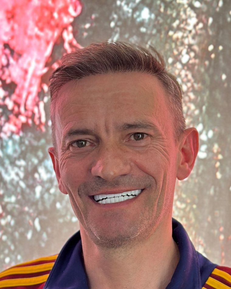 After: fixed full-arch smile on six implants